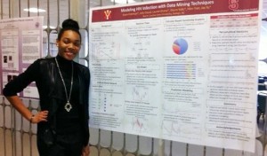 Senior Kayla Coleman with her poster at GSUMC. It was given an "Outstanding" rating.